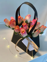 Load image into Gallery viewer, 2 Dozen Wooden Roses in a Black Purse. Restock Coming Soon.