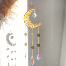 Load image into Gallery viewer, Decorative moon-shaped hanging ornament with crystals on a light background
