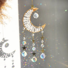 Load image into Gallery viewer, Decorative hanging ornament with moon and star design on a blurred background
